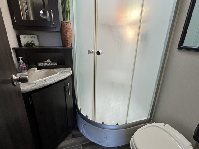 bathroom with corner shower