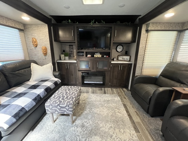 Entertainment centre with TV pull out couch and recliners