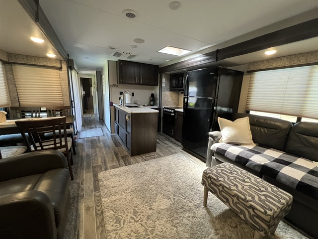 interior shot with kitchen & island, dining area & some living room