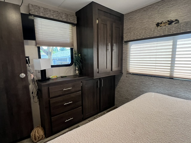 Master bedroom with storage units & dresser